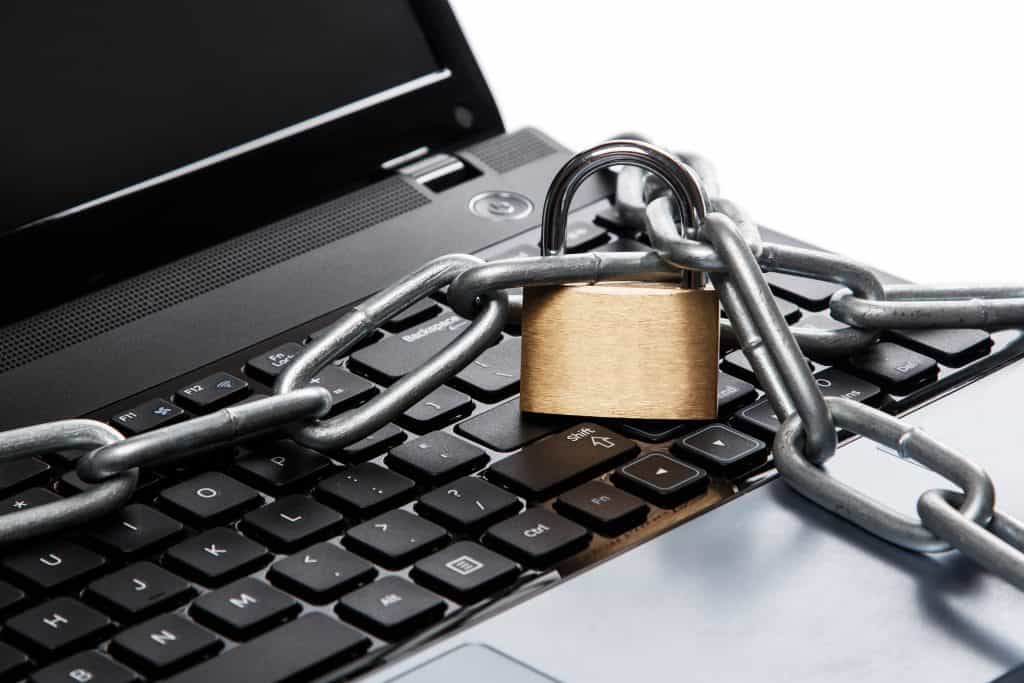 Lock and chain on laptop